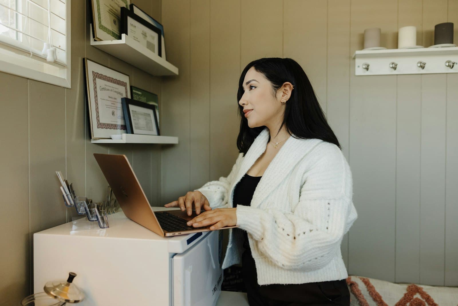 Small business owner working on a laptop at a desk